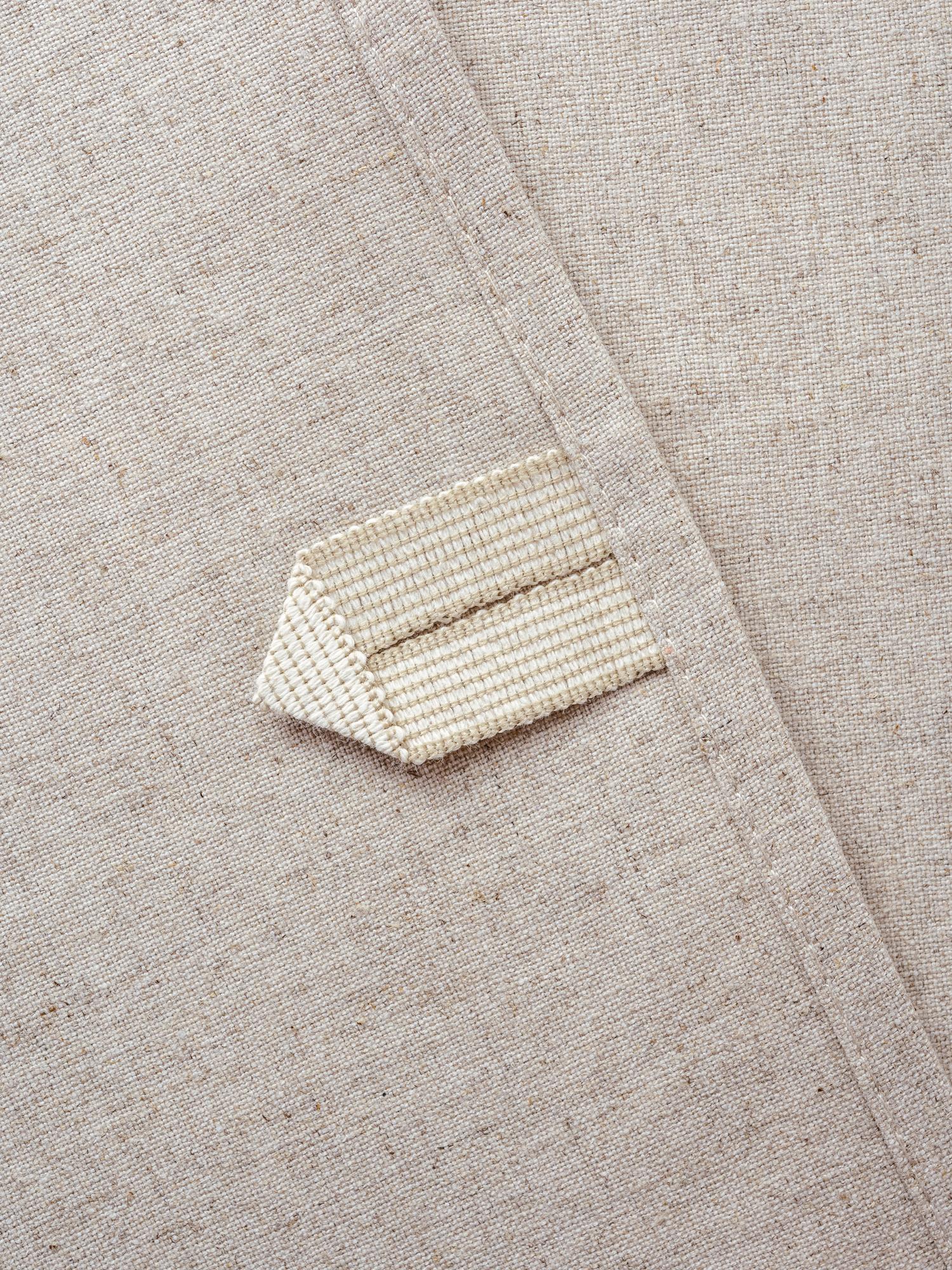 stack of embroidered patches on craft paper