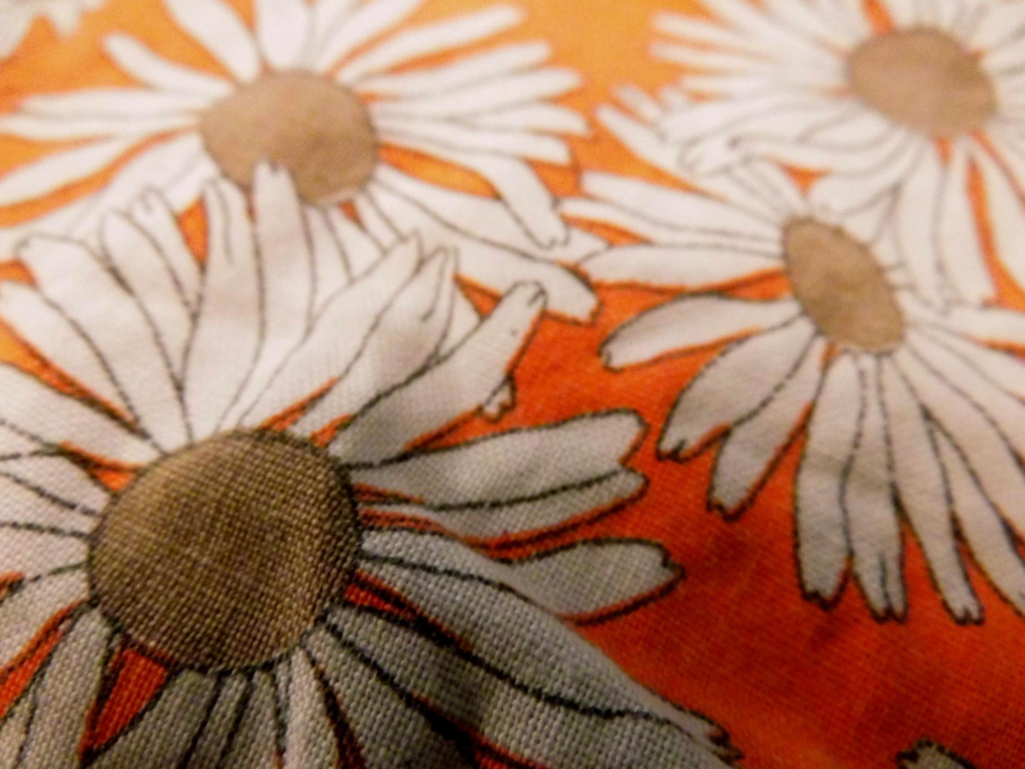 close-up of embroidered flower on linen